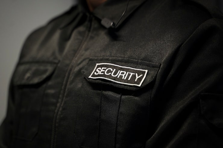 professional security training academy scene with armed and unarmed security officers in tactical gear training in modern facility, Texas environment, high quality professional photography